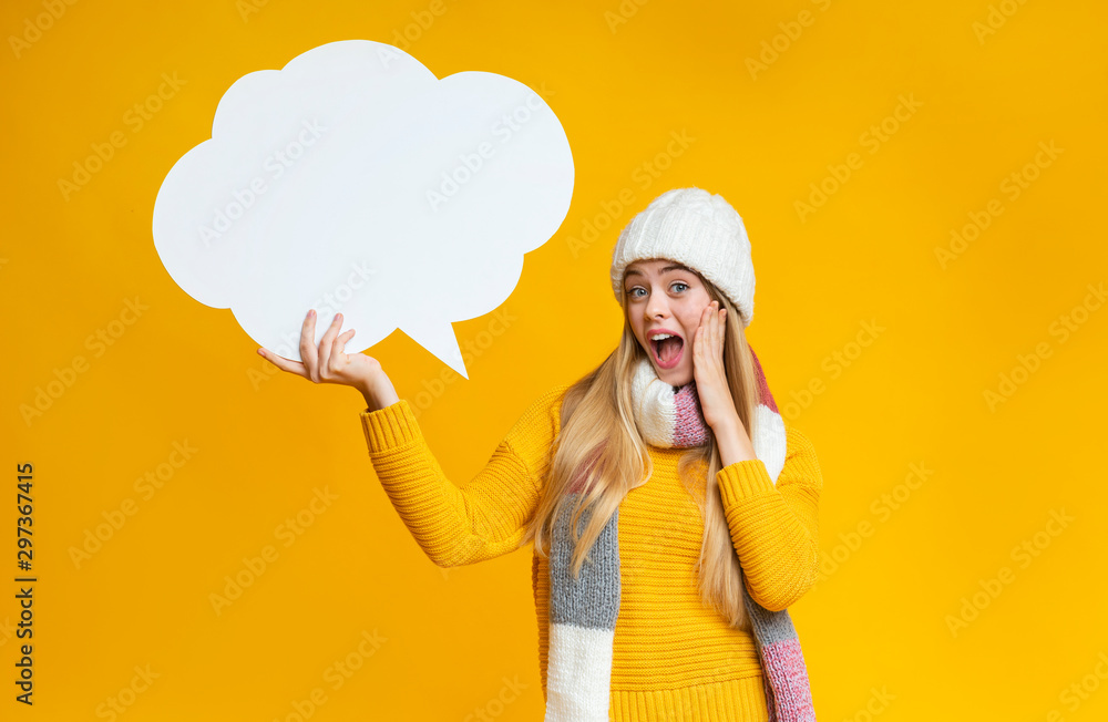 Schocked girl holding communication bubble in her hand Schocked girl holding communication bubble in her hand