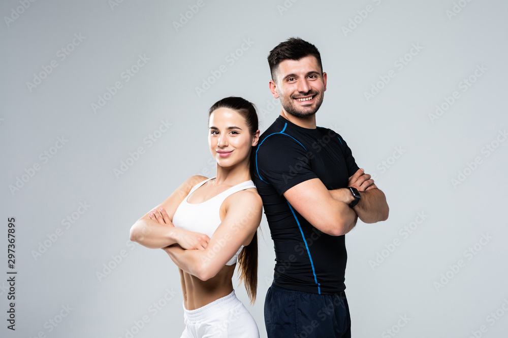 Team of fitness coaches man and woman isolated on white background Team of fitness coaches man and woman isolated on white background