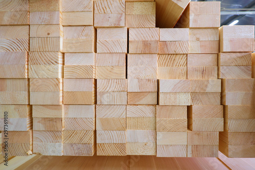 End view of stack of two-layer wooden glued laminated timber beams from pine finger joint spliced boards