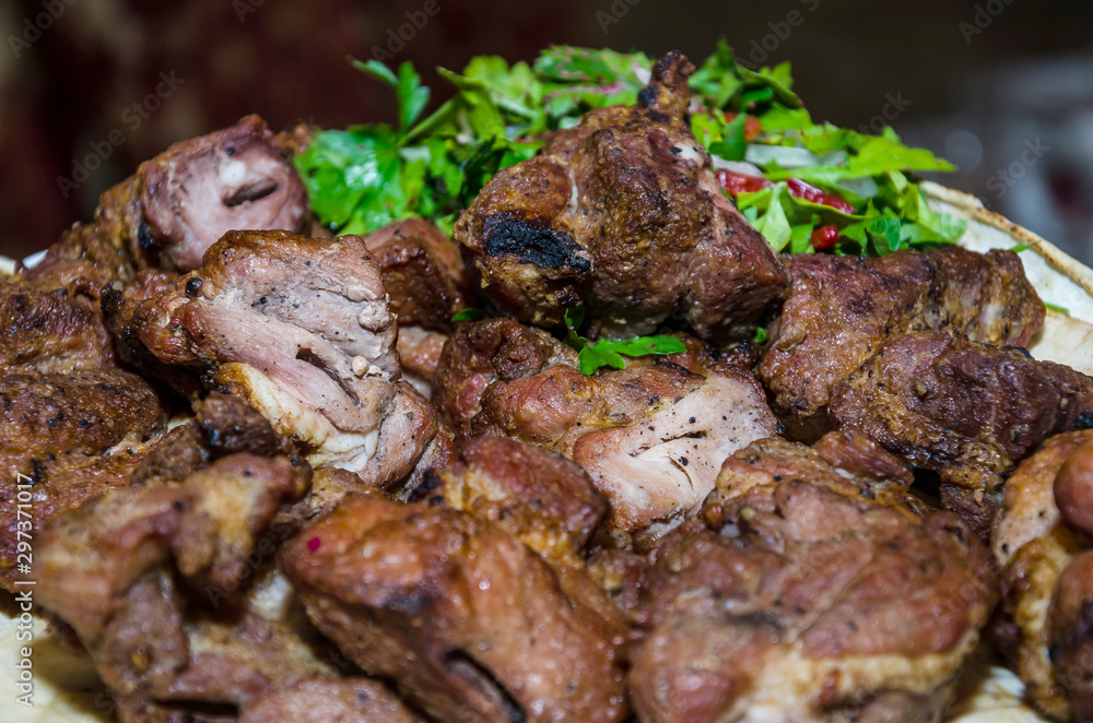 delicious kebabs in a plate. Close-up. Large pieces of meat.