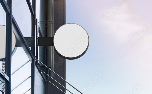 Blank white outdoor round box mockup on glass building photo