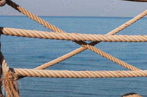 Nautical ropes on a beautiful natural background of the sea.