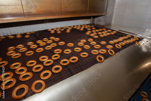 Industrial production of bagel bakery products. Barankin baking conveyor line.Bakery photo