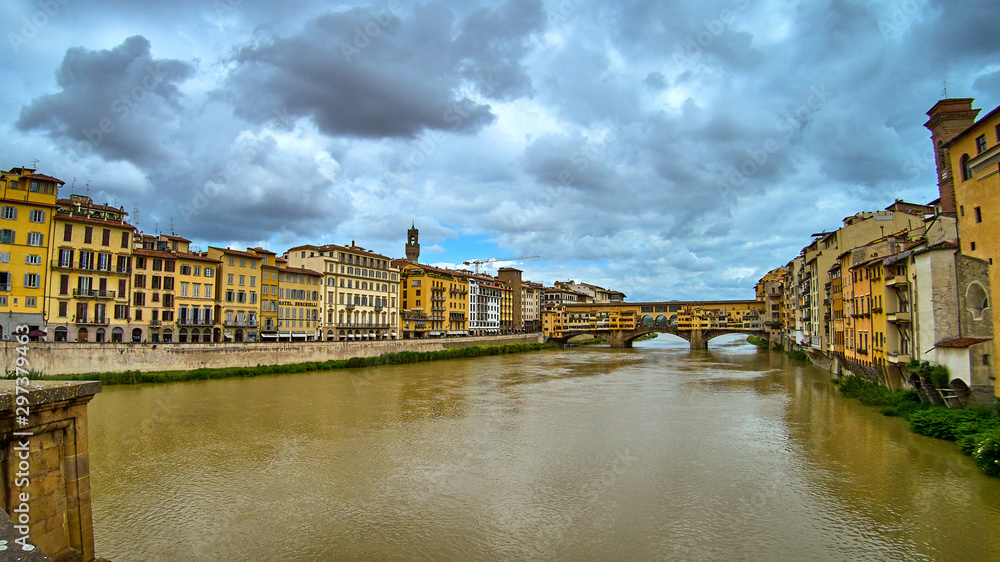 Ponte Vecchio bridge across Arno river in Florence, Italy. View from Ponte Santa Trinita