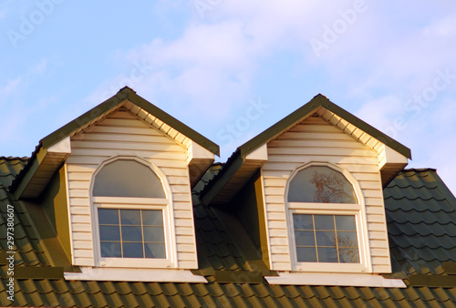 Obraz na płótnie Two attic windows with white frames on the roof of red tiles w salonie