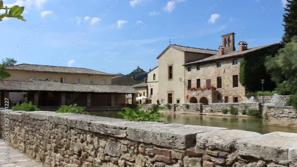 Square of sources in Bagno Vignoni, Siena countryside, Tuscany, Italy, Springtime. Left-Right pan view HD Video of the Thermal bath in the square, a rectangular tank of sixteenth-century origin. Square of sources in Bagno Vignoni, Siena countryside, Tuscany, Italy, Springtime. Left-Right pan view HD Video of the Thermal bath in the square, a rectangular tank of sixteenth-century origin.