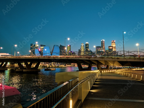 Helix Bridge and Raffles Place CBD in Singapore at night