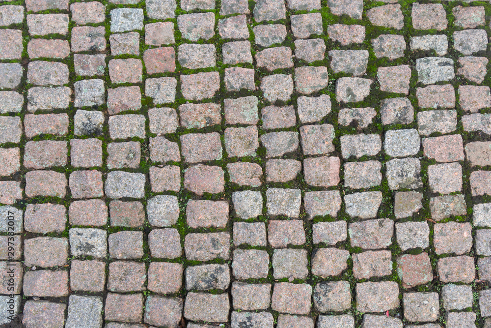 Old road paved with the cobble stones texture walpaper