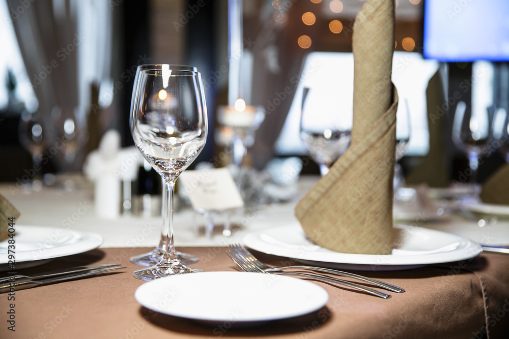 catering at a top event, glasses and flowers on the table, preparation for a significant event, beautiful dishes and glasses on the table, New Year's holiday table catering at a top event, glasses and flowers on the table, preparation for a significant event, beautiful dishes and glasses on the table, New Year's holiday table