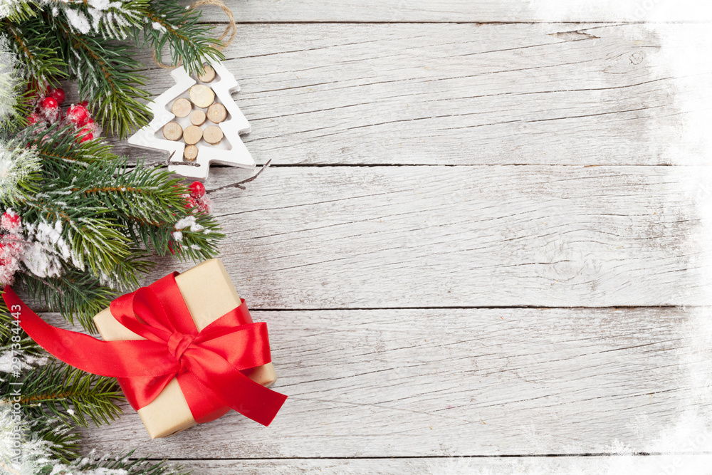 Christmas gift box and fir tree branch Christmas gift box and fir tree branch