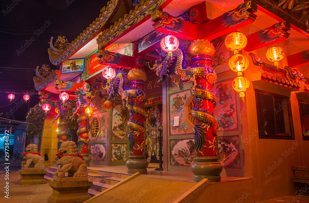 Traditional Chinese Temple in the night on koh Samui, decorated by dragons and lights for The new year