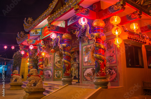 Traditional Chinese Temple in the night on koh Samui, decorated by dragons and lights for The new year © yurich84