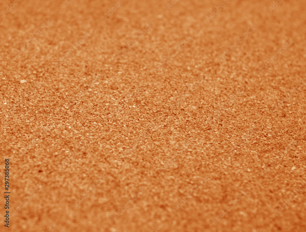Natural cork texture with blur effect in orange color. Natural cork texture with blur effect in orange color.