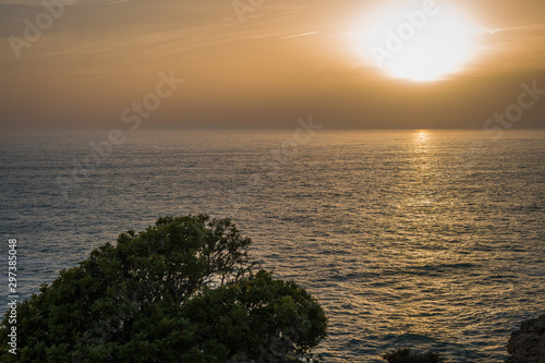 Sunset with the view of the Atlantic sea in Carvoeiro