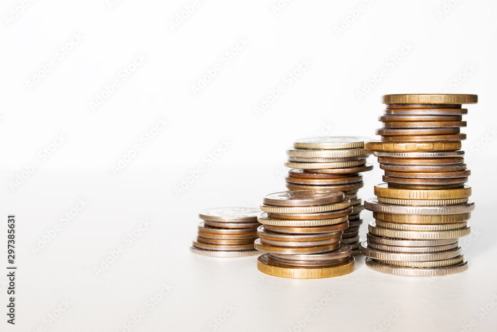 stack of coins business growth concept close-up with place for text on a white background stack of coins business growth concept close-up with place for text on a white background