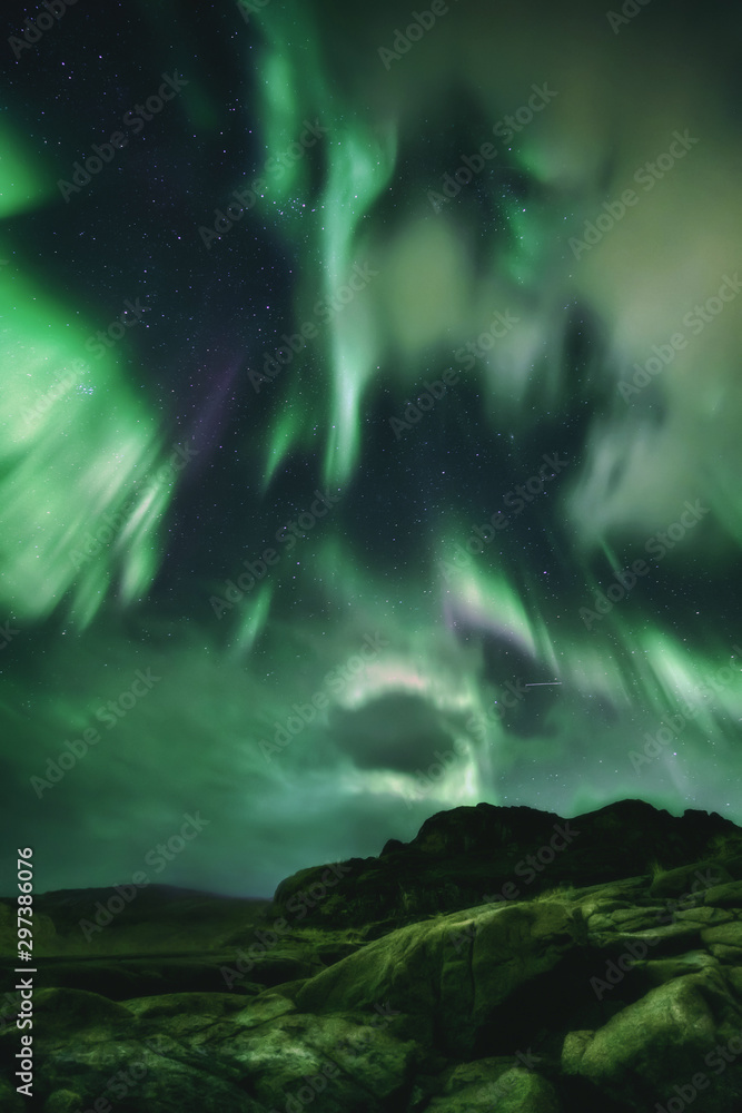 Northern Lights, Aurora Borealis in Kola Peninsula at night sky illuminated green. Murmansk region, Russia Northern Lights, Aurora Borealis in Kola Peninsula at night sky illuminated green. Murmansk region, Russia