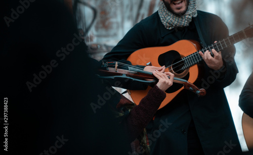 street musicians playing guitar and violin
