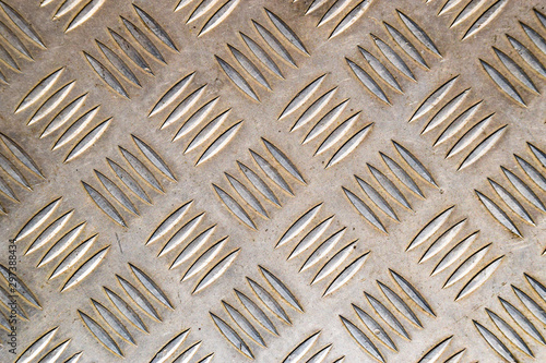 Background metal texture with anti-slip relief. metal sheet