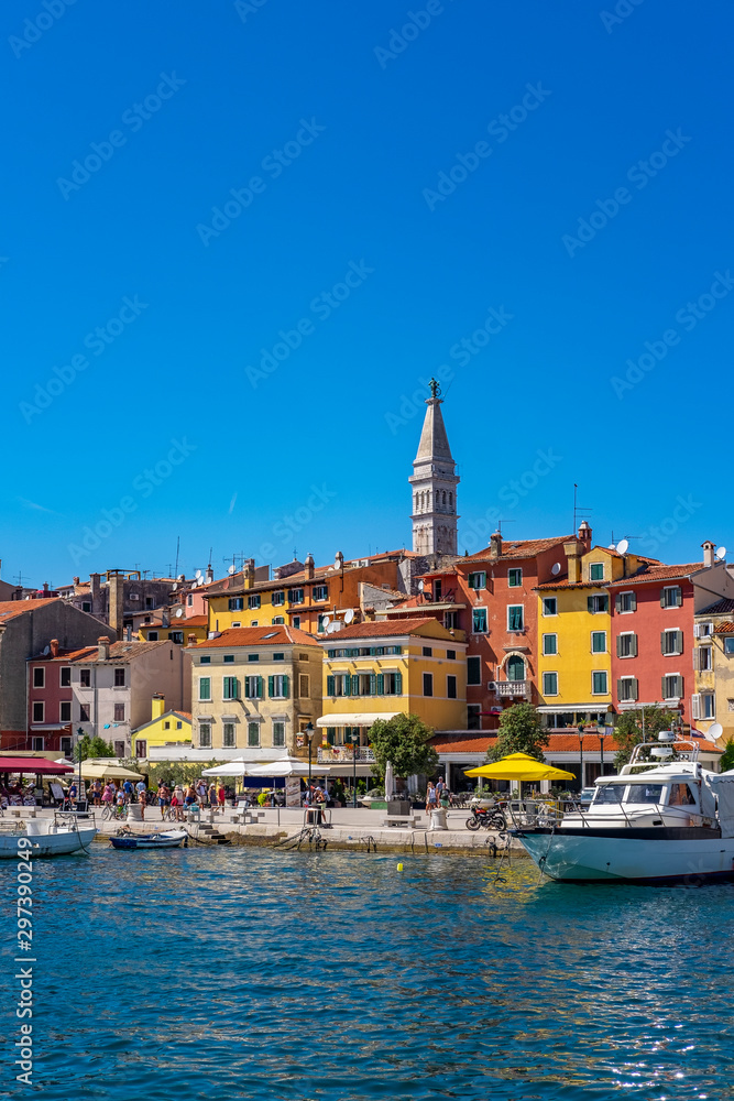 Panoramic view of harbour and houses with colourful facades in Town of Rovinj on sunny summer day, Istra, Croatia