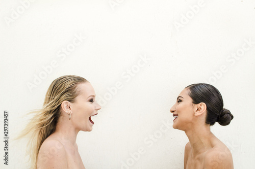 Direct view of two women smiling at each other