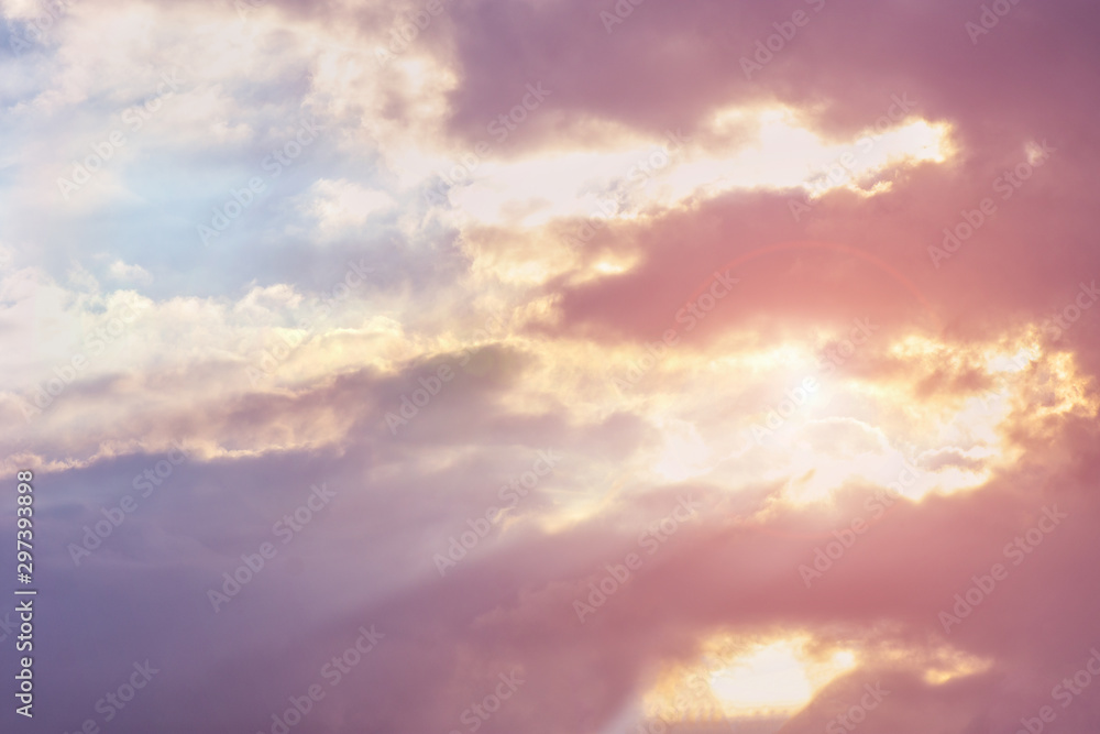 landscape sky with blue clouds and sunbeams at sunset. Background texture