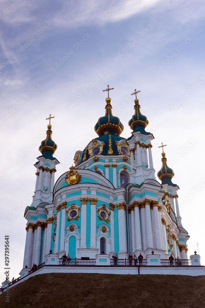 Kiev, Ukraine, October 2019. St. Andrew's Orthodox Church on St. Andrew's Uzvoz in the Ukrainian capital, Kiev. Golden domes against the blue sky.