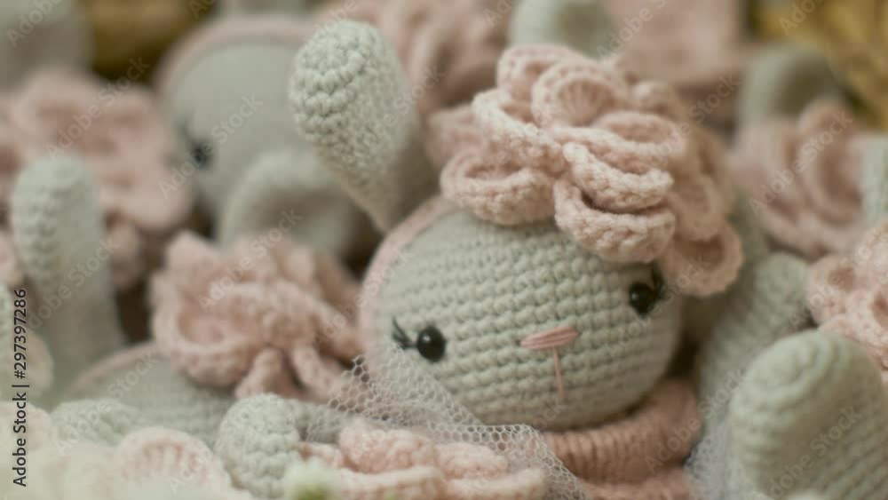 lots of blue knitted rabbits sitting in a wicker lots of blue knitted rabbits sitting in a wicker