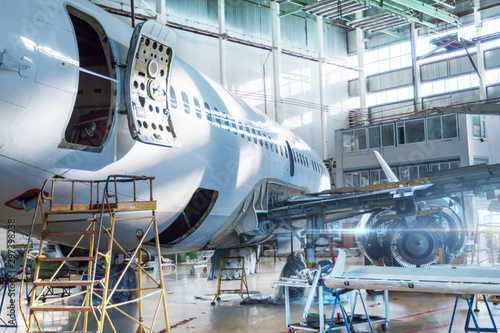 Fotomurale Passenger jet plane under maintenance in the hangar