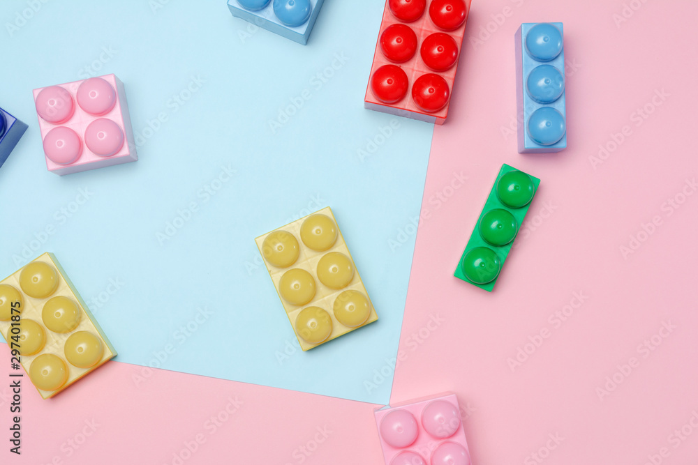 Flat lay of toy bricks on colored background. Educational concept Flat lay of toy bricks on colored background. Educational concept