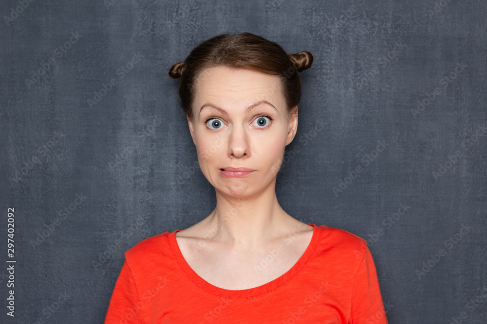 Portrait of surprised perplexed woman looking like stupid user Portrait of surprised perplexed woman looking like stupid user
