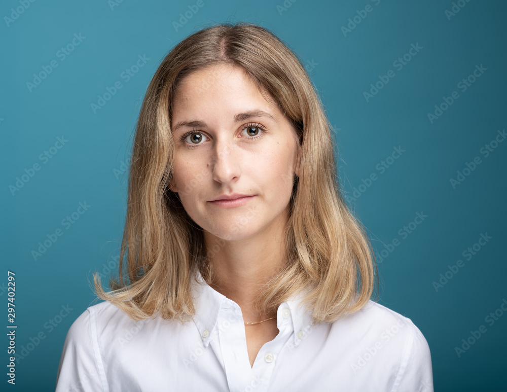 Portrait of a blonde businesswoman in front of blue background Portrait of a blonde businesswoman in front of blue background