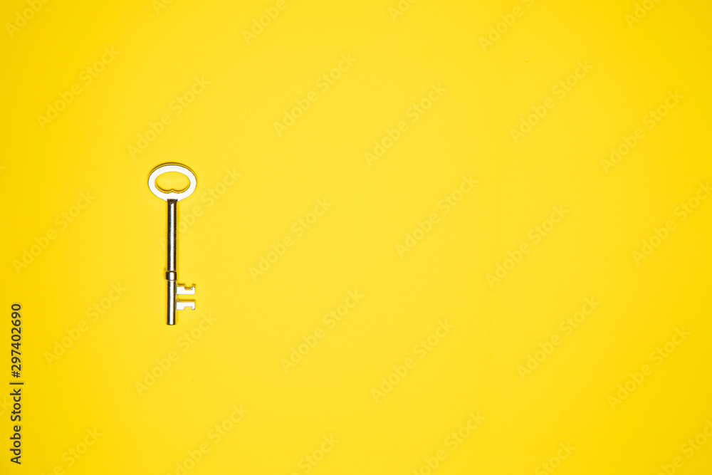 Key on yellow background. Minimal creative style Key on yellow background. Minimal creative style