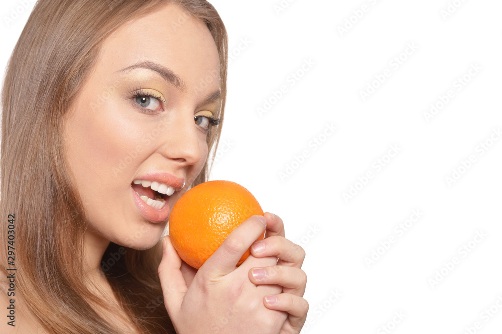 Close up portrait of young woman posing with orange Close up portrait of young woman posing with orange