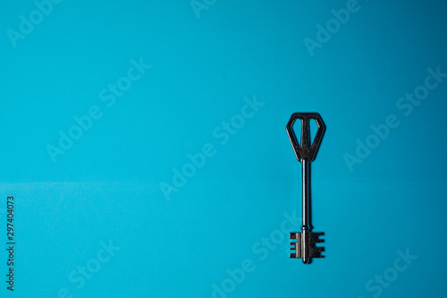 Key on blue background. Minimal creative style