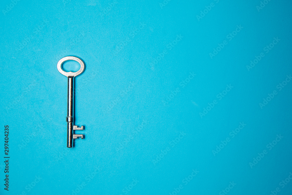 Key on blue background. Minimal creative style