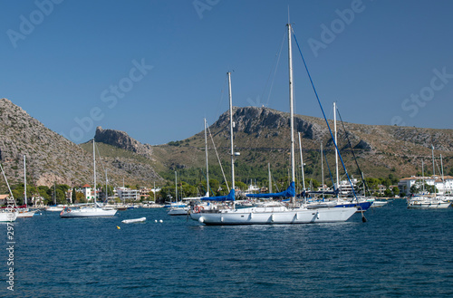Port de Pollenca Majorca view of yacht's moored in the beautiful bay of Pollensa with a lovely backdrop of mountains.