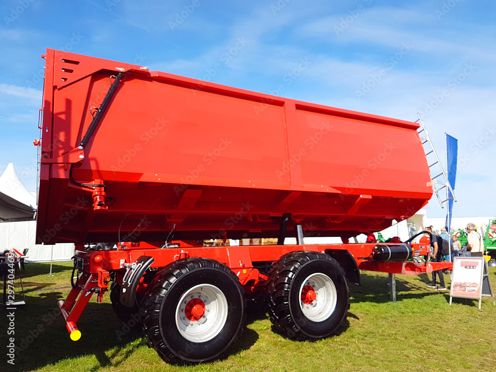 Fototapeta premium Big red trailer for loading with wheat