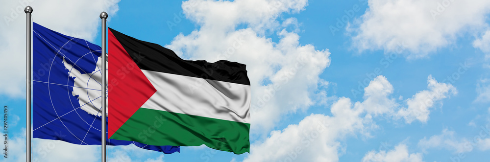 Antarctica and Palestine flag waving in the wind against white cloudy blue sky together. Diplomacy concept, international relations. Antarctica and Palestine flag waving in the wind against white cloudy blue sky together. Diplomacy concept, international relations.