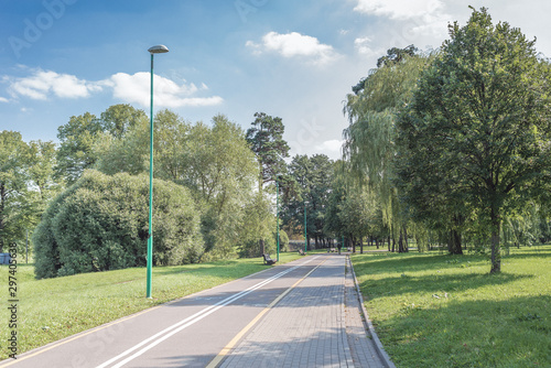 Wallpaper Mural Bike path in the park with green grass and trees. Beautiful summer landscape. Torontodigital.ca
