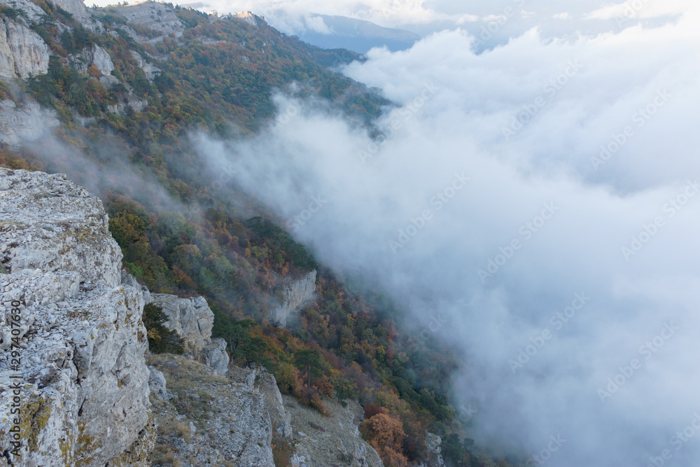 Autumn trees on the mountain slope with clouds Crimea Autumn trees on the mountain slope with clouds Crimea