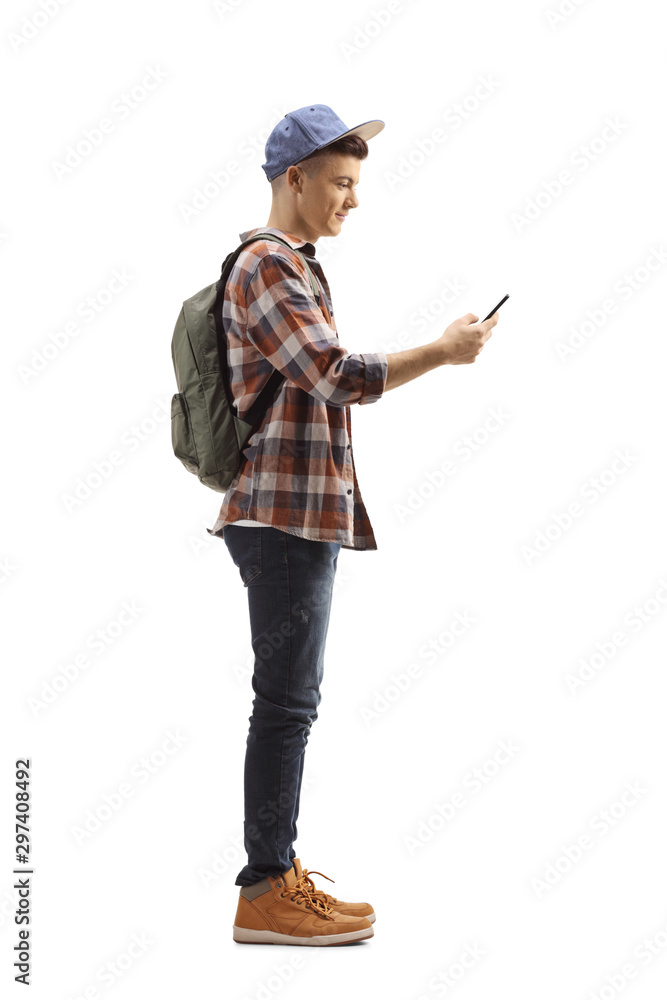 Male student with a backpack and a mobile phone Male student with a backpack and a mobile phone