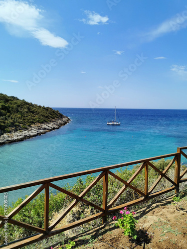 Aerial shot of a virgin beach and a boat on the sea