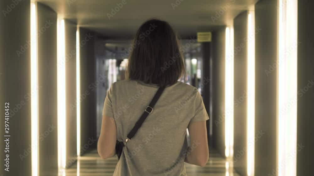 Travel woman using smartphone audio message voice recognition airport. Young Caucasian traveler checking boarding time with mobile phone app in terminal or train station. Travel woman using smartphone audio message voice recognition airport. Young Caucasian traveler checking boarding time with mobile phone app in terminal or train station.