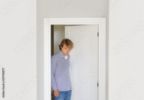 Man opening the door of him home.