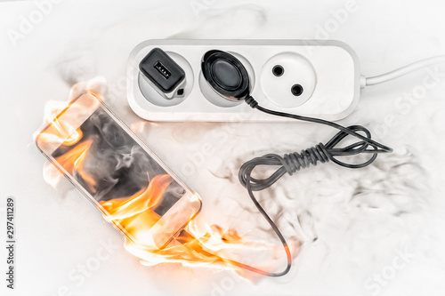 Wallpaper Mural phone on fire connected to the power supply Torontodigital.ca