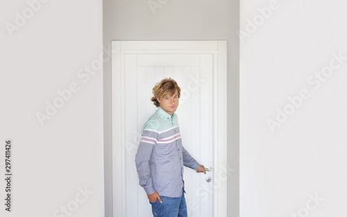 Man opening the door of him home.