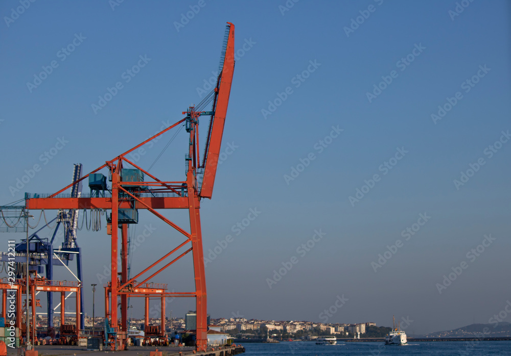 Istanbul trade port. Container and orange crane. It was taken over the sea.
