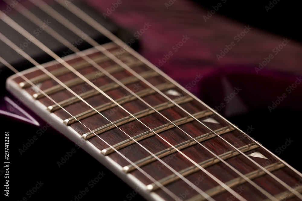 Fretboard of modern electric guitar on black background. Fretboard of modern electric guitar on black background.
