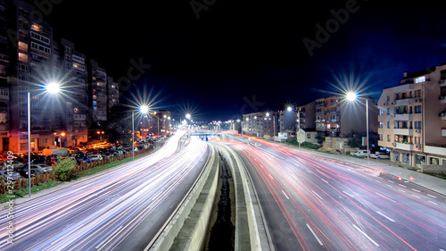 traffic in the city at night © damianbn