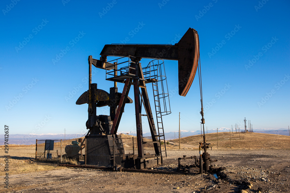 View of Oil Well Pumpjack (Horsehead) at Daylight Oil Industry View of Oil Well Pumpjack (Horsehead) at Daylight Oil Industry